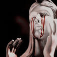 statue of a woman crying blood with a link to a video of taemin performing sexuality at a concert